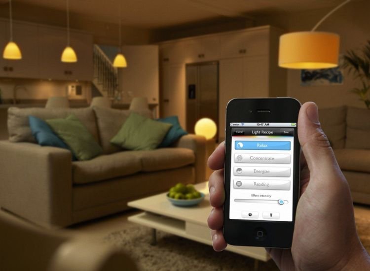 A Well Lit Living Room With Light Control By A Smartphone Capturing The Essence Of Modern Technology And Home Comfort