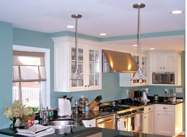 Turquoise paint in a small kitchen, adding a fresh and lively touch while creating an inviting and cheerful atmosphere.