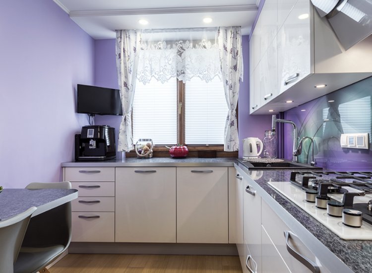 Purple kitchen walls providing a bold and creative backdrop, adding personality and vibrancy to the culinary space.