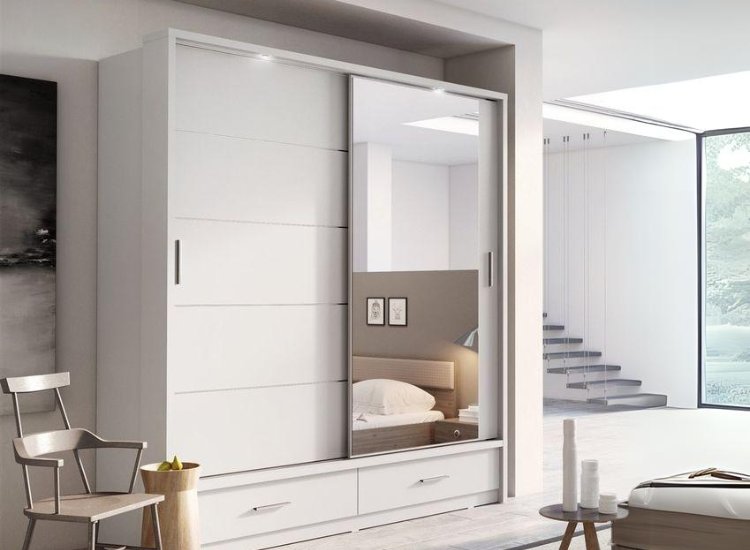 Sliding wardrobe design with drawers below, offering efficient storage solutions while maintaining a clean and modern appearance.