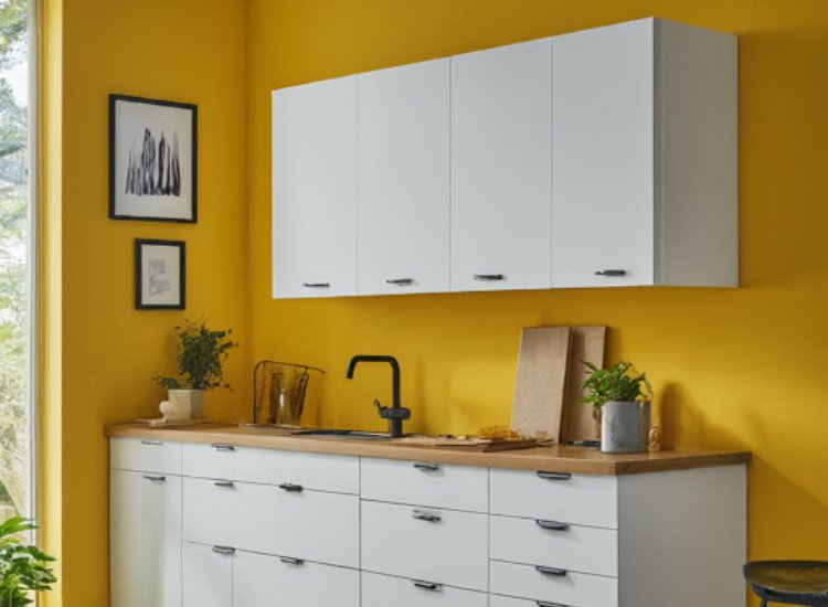 Elegant kitchen featuring bright yellow walls that enhance the overall aesthetic, creating a warm and inviting atmosphere.