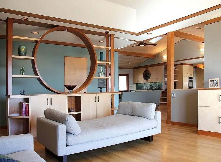 Stylish wooden circular partition design in a living room, creating an inviting and modern separation of space.