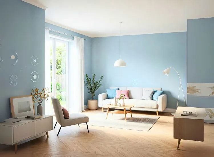 Scandinavian living room interior with light wood furniture, a grey sofa, and enough hygge to make even your TV wall feel hugged.