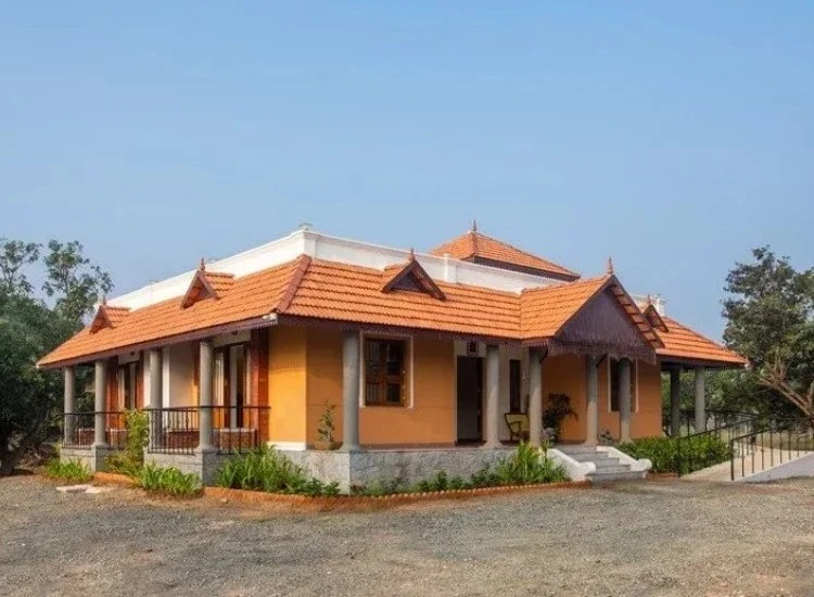6. Shingles for house front design Traditional shingle exterior on a house, showcasing textured layers and a classic aesthetic that adds warmth and character.