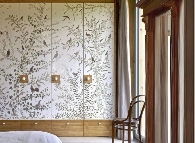 8. Wardrobe Design Pattern Wardrobe design featuring a beautiful tree and birds pattern, adding a whimsical touch and enhancing the room's aesthetic appeal.
