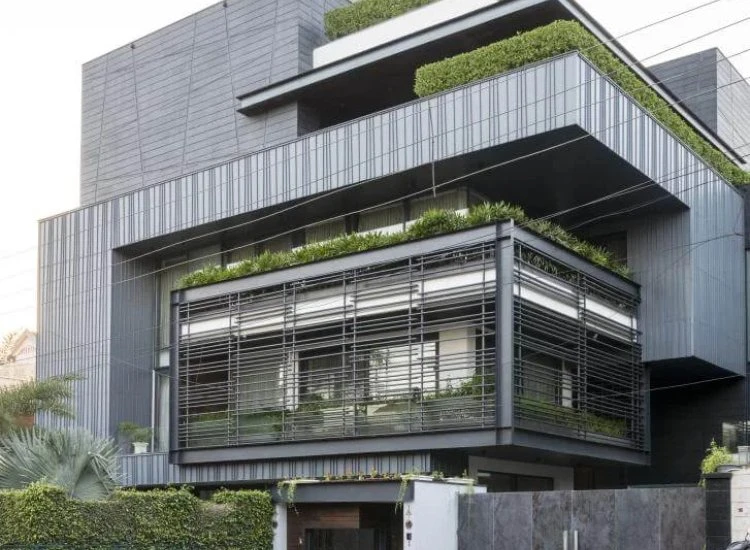 9. Zinc sheets and bars for house front design Contemporary zinc sheet and bar facade on a house, featuring a sleek finish and industrial appeal that enhances modern architecture.