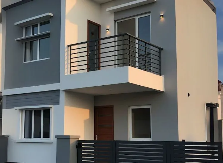 Small Balcony with Metal Railings Modern home front elevation design with a small balcony and stylish metal railings, complementing the sleek double-floor exterior.