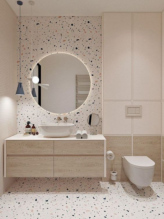 A contemporary bathroom featuring authentic terrazzo tiles, giving a high-end look the the bathroom