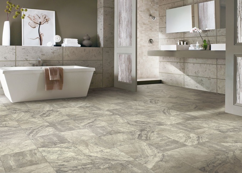 A roomy bathroom with vinyl composite tiles flooring and sleek tile design, exuding luxury and sophistication