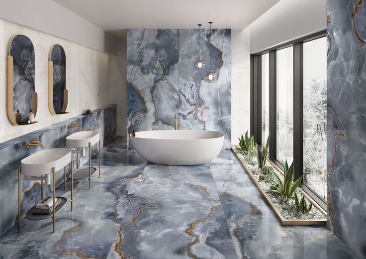 An opulent bathroom showcasing beautiful marble flooring and walls adorned with a calming blue color scheme