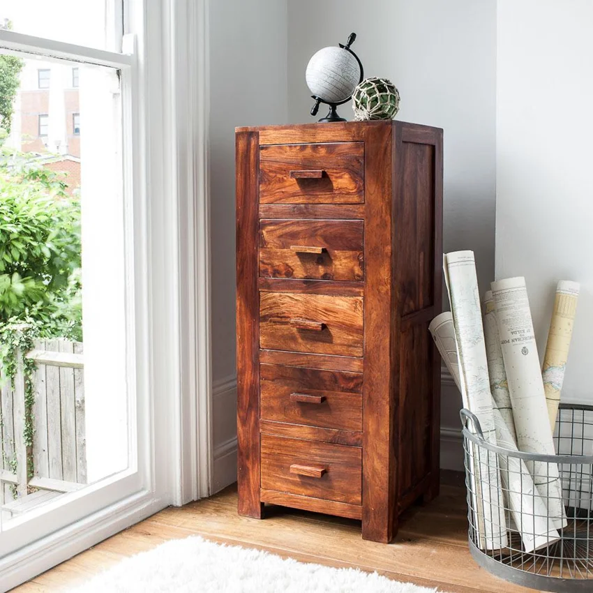Sheesham wood chest of drawers providing storage and adding rustic charm to the space