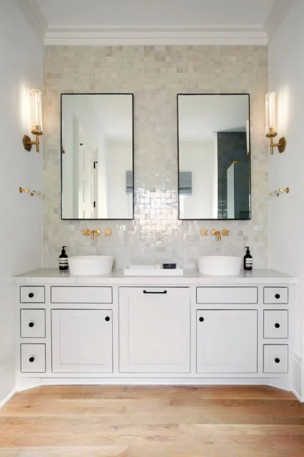 modern LED fixtures strategically placed around the mirror.