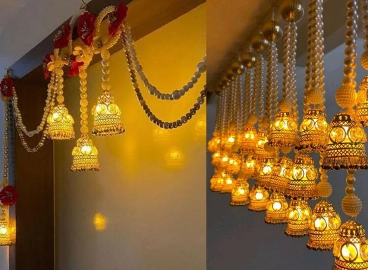 14. Diwali Toran Diwali lighting photo of candles and fairy lights illuminating marigold garlands, creating a festive ambiance.