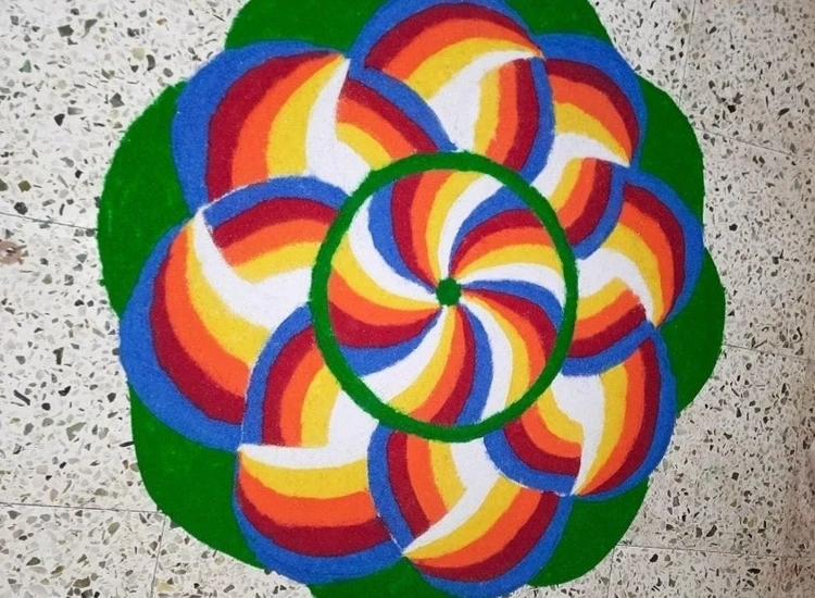 19.Geometric Rangoli Stunning geometric rangoli with symmetrical shapes and bold colors, enhancing the festive spirit during Diwali