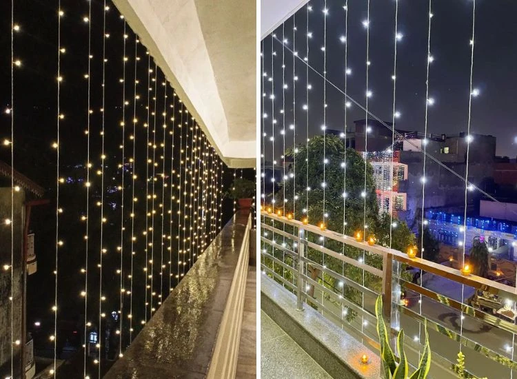 24. Diwali vertical LED Lighting Stunning Diwali exterior lighting with vertical lights cascading from the top floor to the bottom, complemented by diyas on the balcony railing.