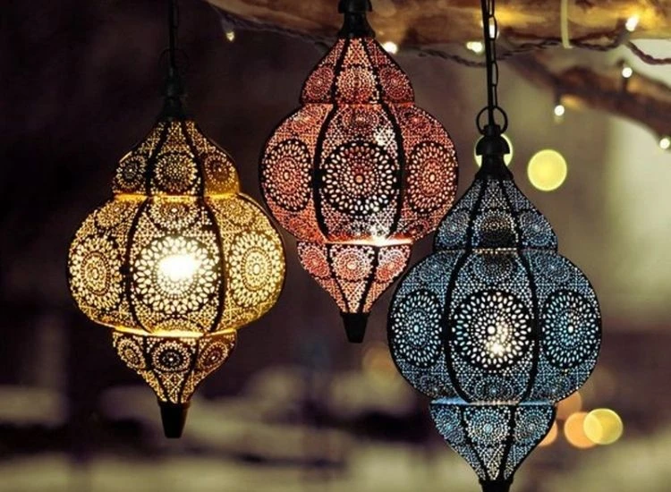 29.Lantern Design Elegant Diwali images of flickering oil lamps placed in a decorated corner filled with flowers and rangoli.