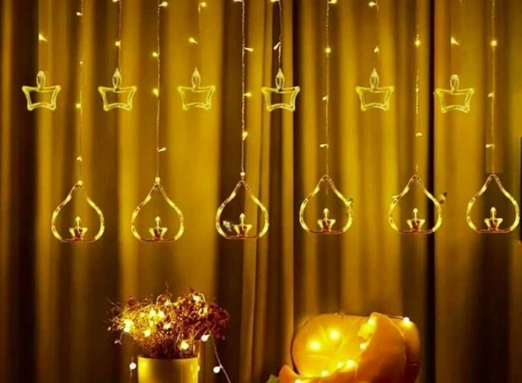 3 .Diya Lighting "Warm Diwali lighting images of twinkling lights framing a window, filling the room with a cozy and festive atmosphere."
