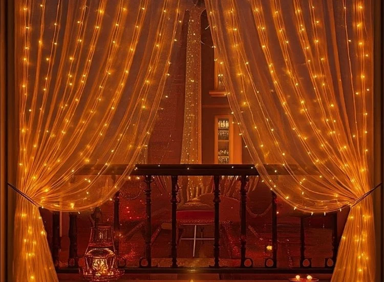 5. Curtain Lights Beautiful Diwali lighting photo with traditional oil lamps illuminating a cozy living room full of festive décor