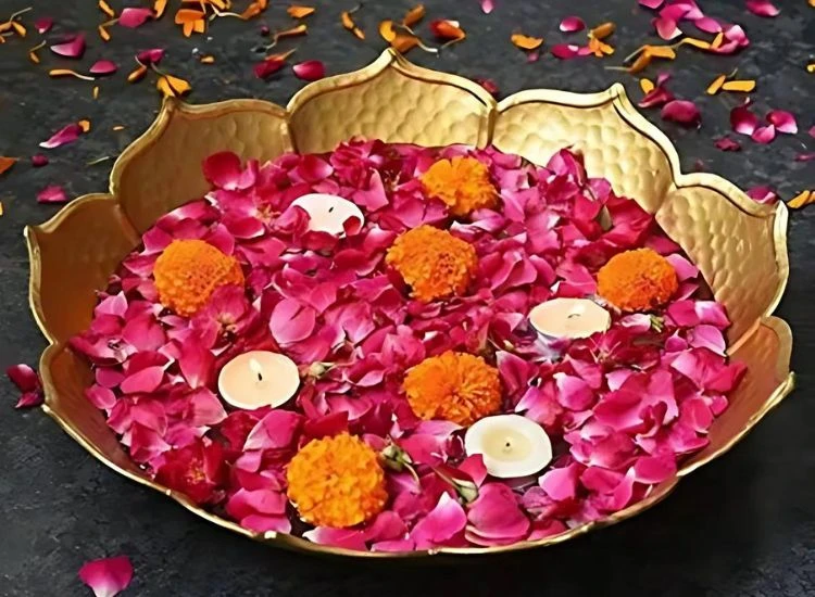 Urli Design for diwali Decorative Urli Design for diwali with rose petals and marigold flowers complemented by small diyas