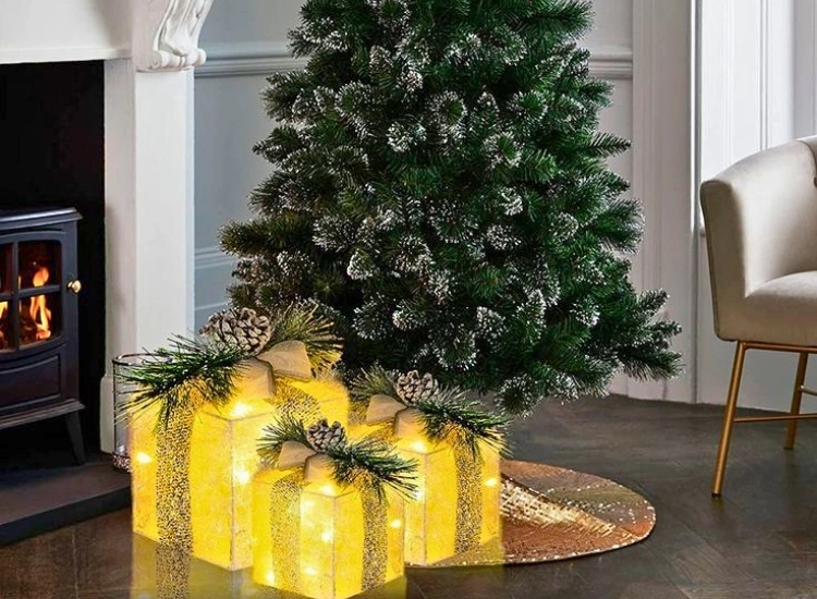 "Light-up gift boxes placed under the Christmas tree, enhancing the festive decor. Christmas tree picture included."