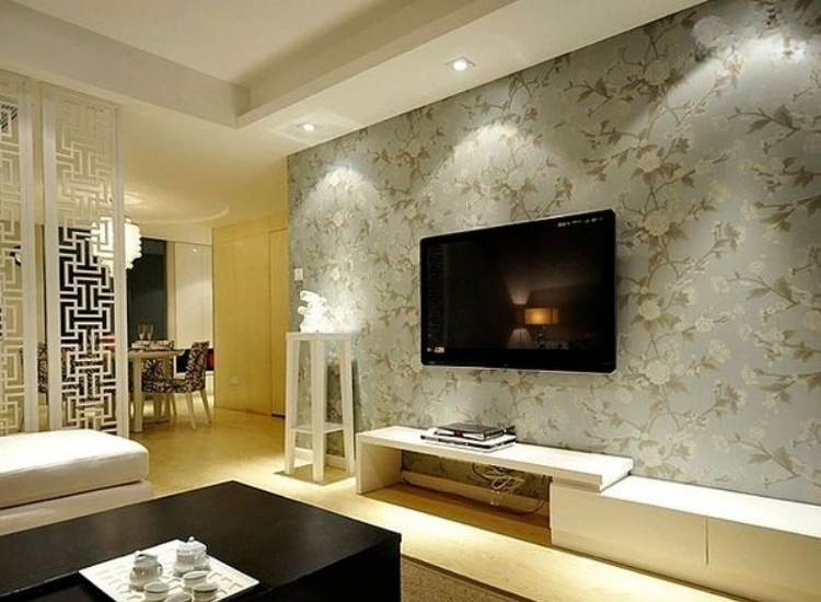 33. TV Unit with Wallpaper "TV unit with wallpaper design, adding personality and flair to your setup with stylish patterns and textures for a unique living room look."