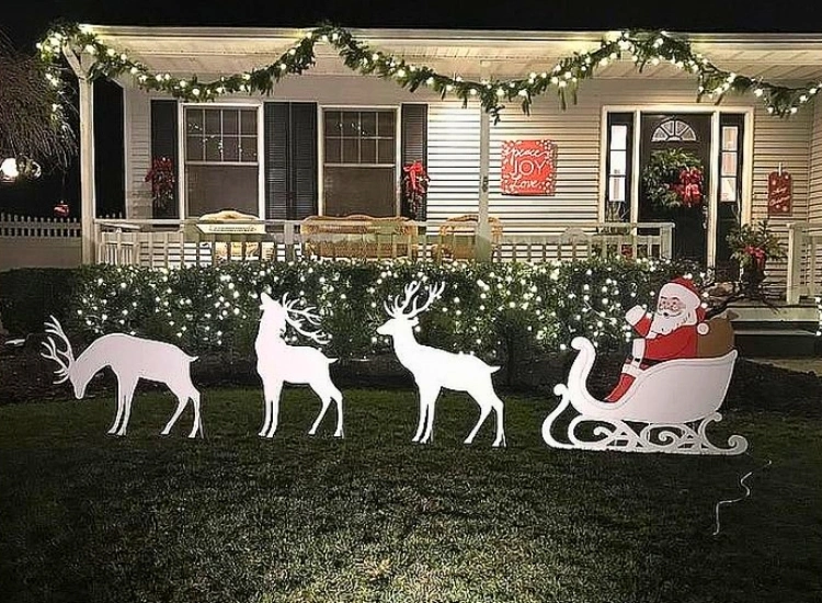 "Bold Christmas decor garland adorning the doorway, welcoming holiday spirit. Christmas tree picture included."