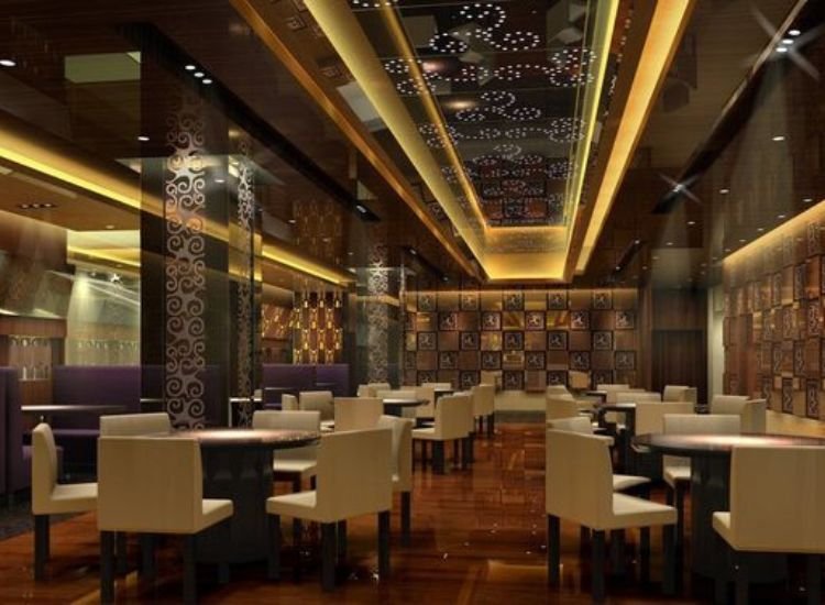 Modern restaurant interior professionally lit with stylish, well-designed lighting, creating a welcoming atmosphere and enhancing the dining experience.