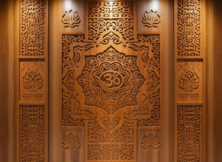 A beautifully crafted WPC panel designed for a pooja room background, featuring intricate CNC carvings with traditional symbols and motifs, enhancing spiritual ambiance.