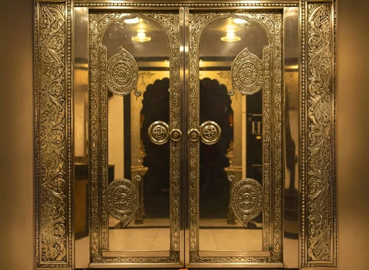 16. Pooja Room Door Design With A Metallic Finish 16. Pooja Room Door Design With A Metallic Finish