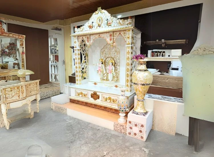 19. Marble Pooja Unit With Gold Leaf Detailing 19. Marble Pooja Unit With Gold Leaf Detailing