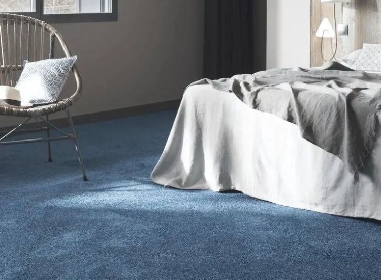 22. Blue carpet flooring in bedroom