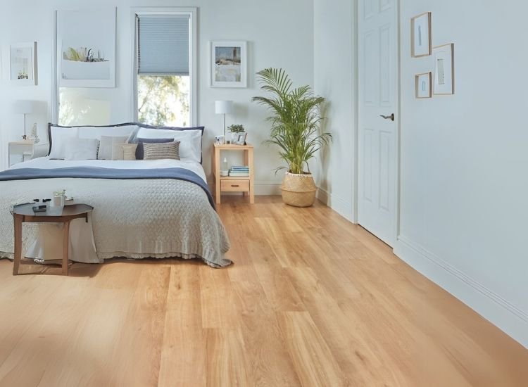 A comfortable bed and hardwood flooring creating relaxed and cozy ambiance in contemporary style bedroom