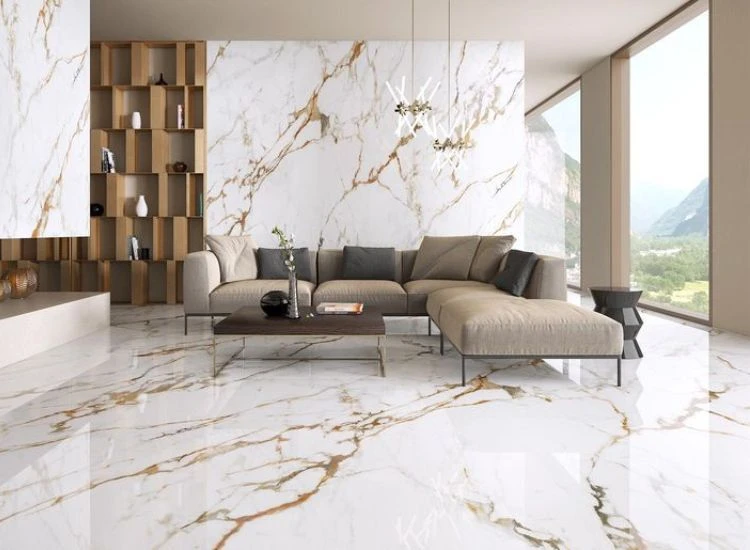 8. Calacatta italian marble White and gold Calacatta marble flooring and wall paneling featuring stylish gold veins in the living room.