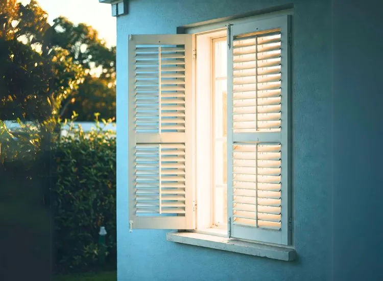 12. Louvered Window Modern home featuring louvered windows, offering a smart and stylish solution for ventilation and sleek design.