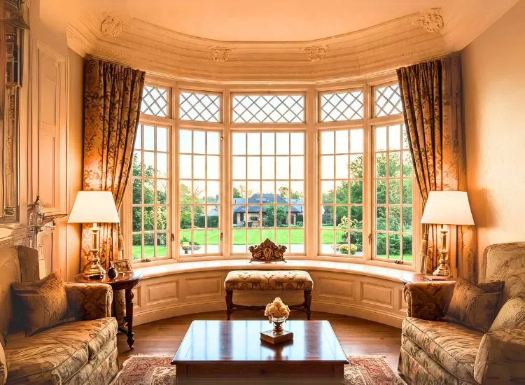 2. Bay And Bow Window Charming home facade with classic bay and bow windows, offering spacious interiors and timeless home window design ideas.