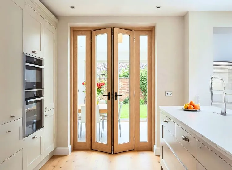 9. Bifold Door Stylish bifold door design in wood, offering a space-saving solution and modern aesthetic for house interiors and door types.